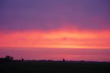 Ochtendrood met wat neerslag in de lucht, die de grond niet bereikt - Joost Mooij