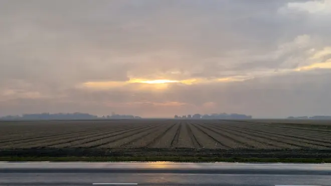 Een gaatje in de wolken boven Texel - Frans Alderse Baas